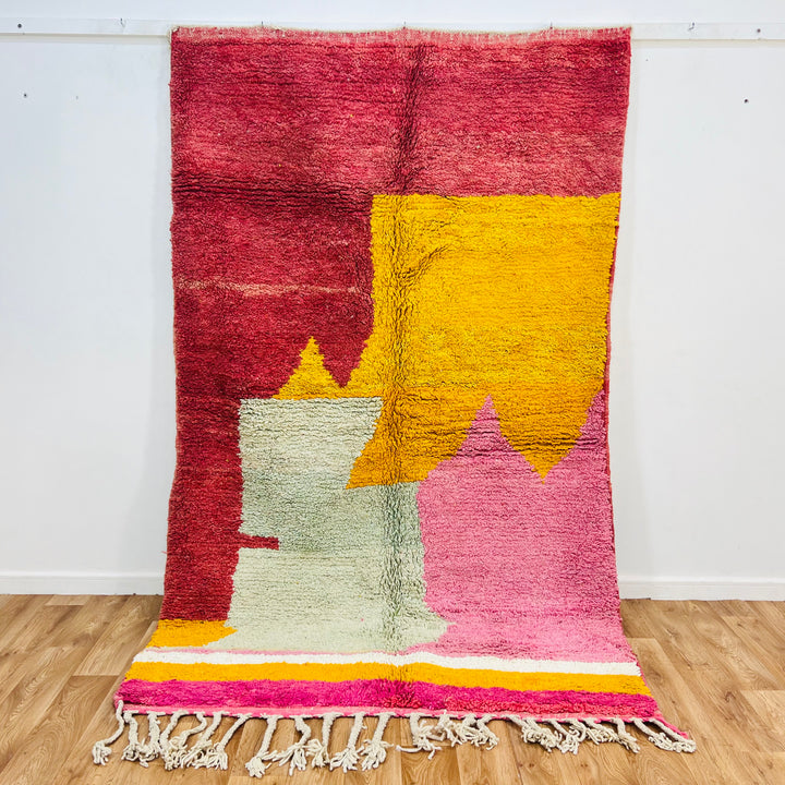 Bold abstract vintage Moroccan rug with red, yellow, sage, and pink blocks. Handmade by Berber artisans, 253x158 cm, wool.