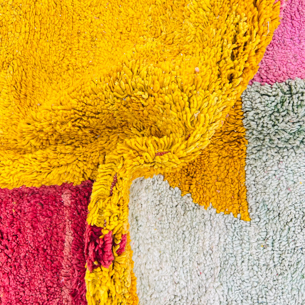 Vibrant abstract vintage Moroccan rug with crimson, yellow, sage, and pink colors, handmade from wool by Berber artisans.