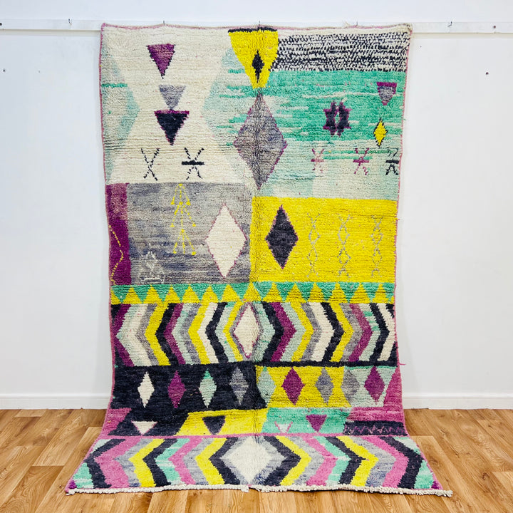 Vintage Moroccan Berber rug with colorful diamond and zigzag patterns, handwoven, 250x153 cm. Traditional wool area rug from Morocco.