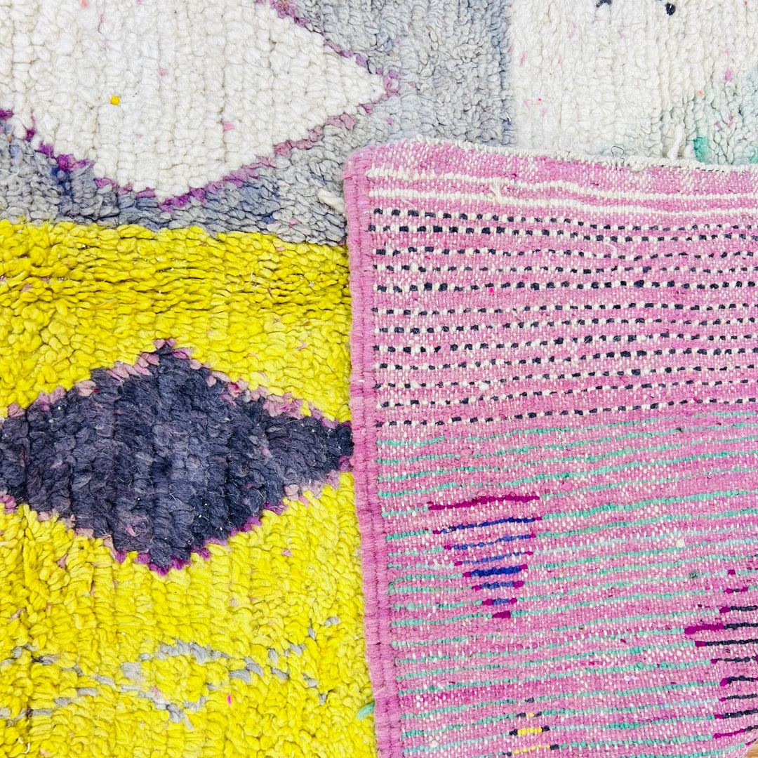 Colorful Vintage Moroccan Rug with diamond pattern, featuring yellow, pink, and blue hues. Ideal Moroccan berber and runner rug.