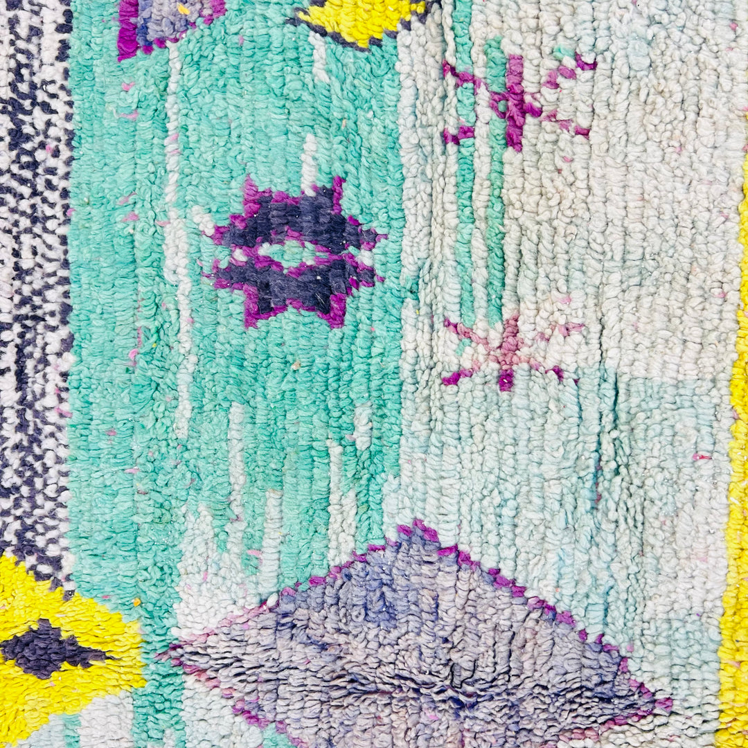 Vintage Moroccan Berber Rug with colorful geometric patterns, handwoven wool. Traditional Moroccan carpet in aqua, purple, and yellow.