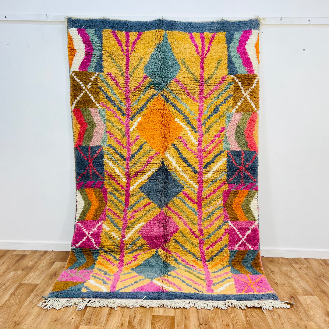 Colorful vintage Moroccan wool rug with geometric patterns and vibrant colors, 248 x 160 cm, handwoven by Berber women.