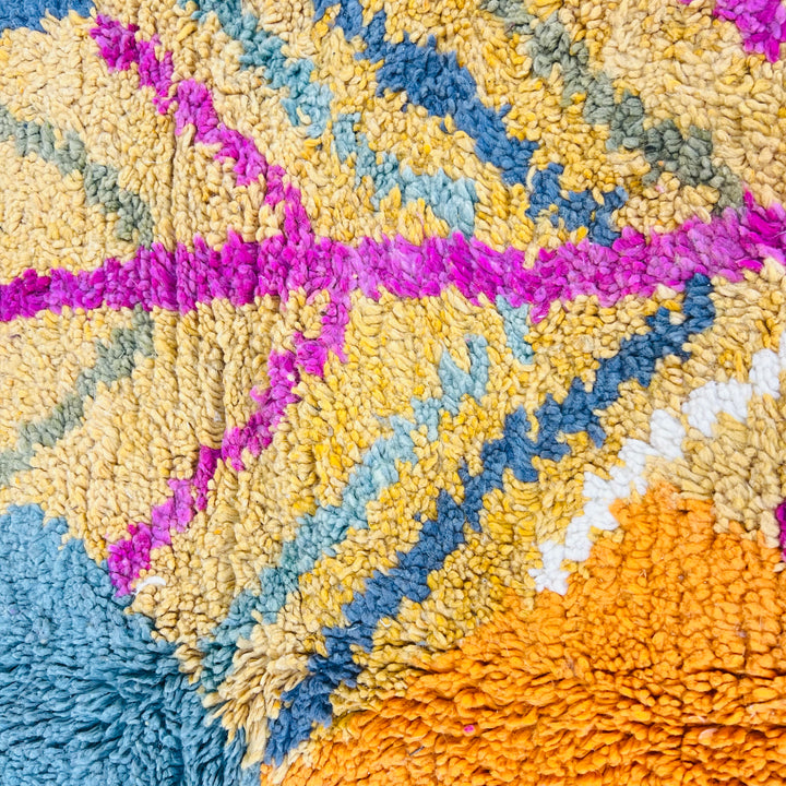 Colorful vintage Moroccan wool rug with ochre, fuchsia, teal, and orange geometric patterns. Perfect for adding warmth and style.