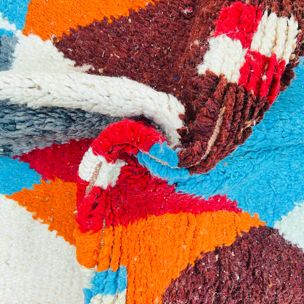 Bold geometric vintage Moroccan wool rug with bright colors, traditional Berber design, and diamond patterns for sale.