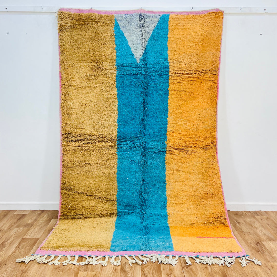 Modern Moroccan wool rug with bold color blocks in mustard, turquoise, and orange hues, handwoven by Berber artisans, size 8.3 x 5.3 ft.