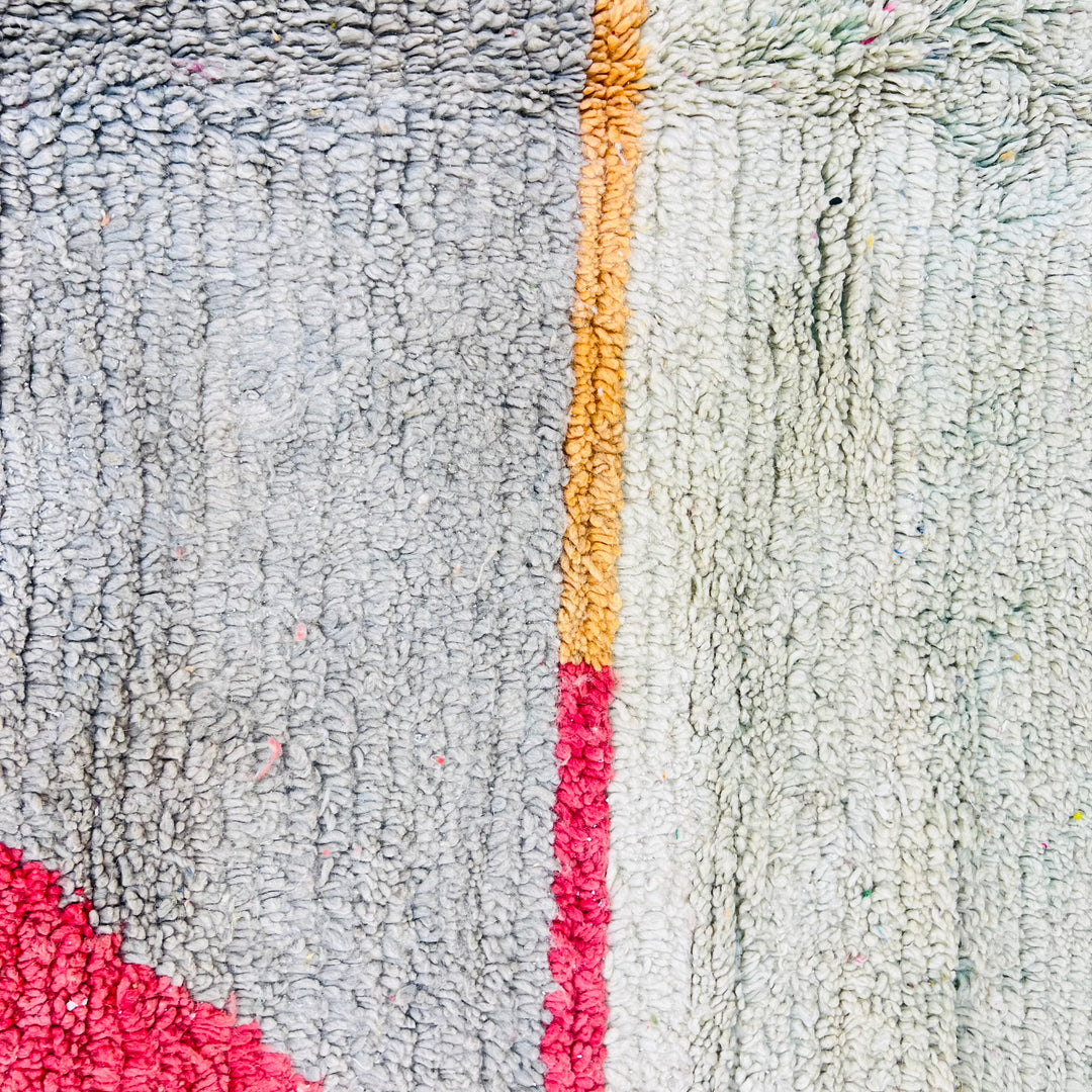 Color block Moroccan wool rug with mustard, gray, red, and pink triangular design, handmade Berber style, 257x164 cm.