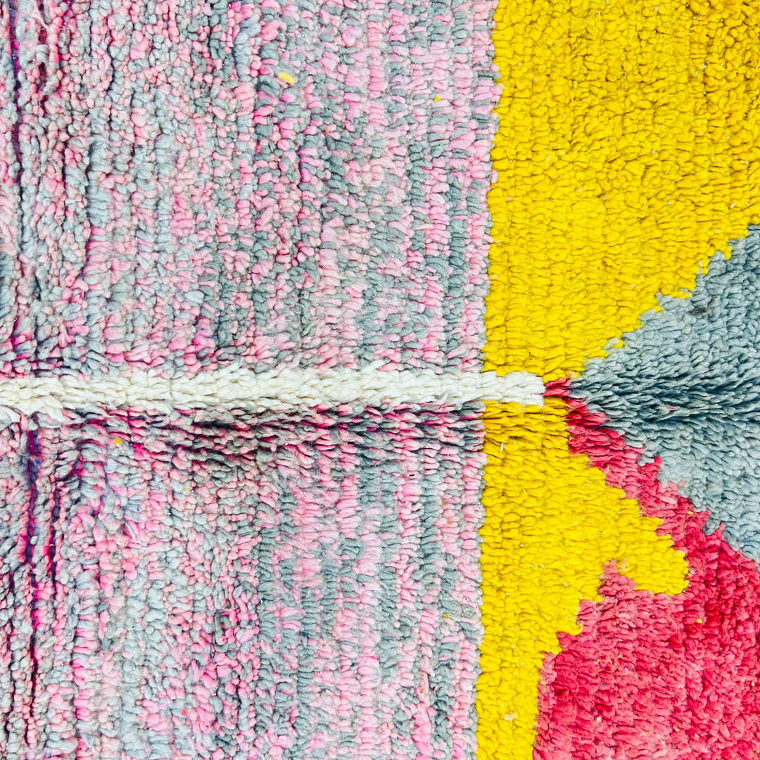 Color block Moroccan wool rug with mustard, gray, red, and pink triangles; handmade Berber design, 8.43 x 5.38 ft, perfect statement piece.
