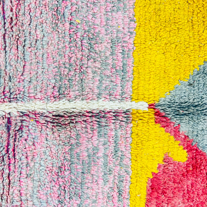 Color block Moroccan wool rug with mustard, gray, red, and pink triangles; handmade Berber design, 8.43 x 5.38 ft, perfect statement piece.