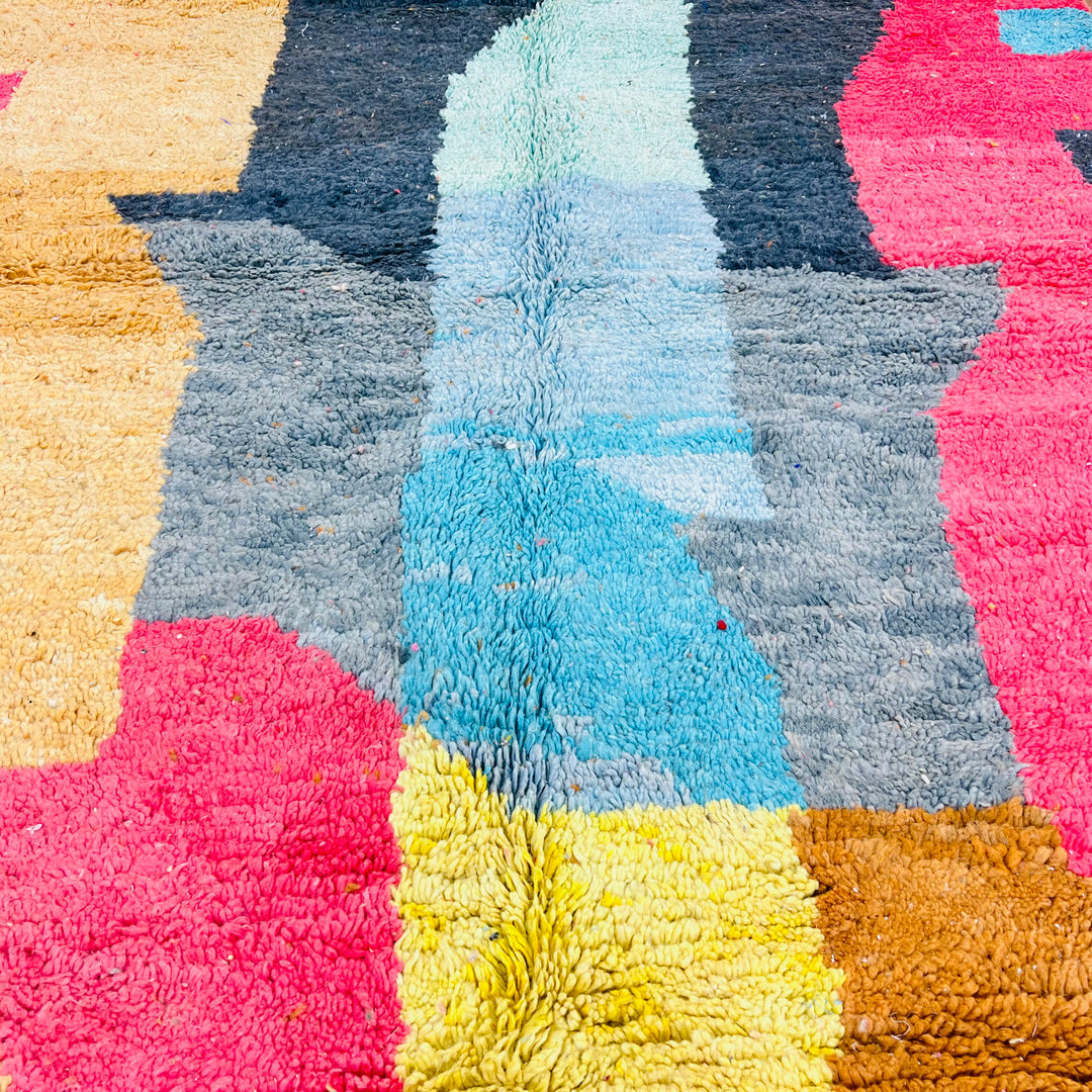 Colorful abstract vintage Moroccan rug with geometric patterns in pink, blue, yellow, and grey hues, 250×161 cm handwoven design.