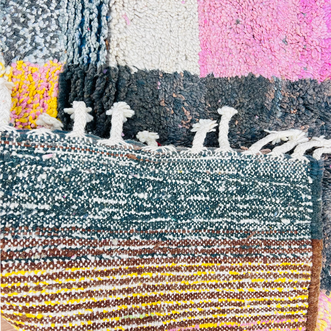Vintage Moroccan wool rug with pink, blue, yellow blocks; handcrafted by Berber artisans. Traditional Moroccan rug.