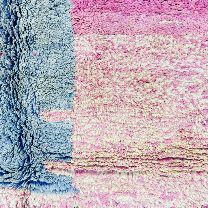 Close-up of Vintage Moroccan Wool Rug with pink and blue blocks, handcrafted by Berber artisans, adding texture and warmth to any space.