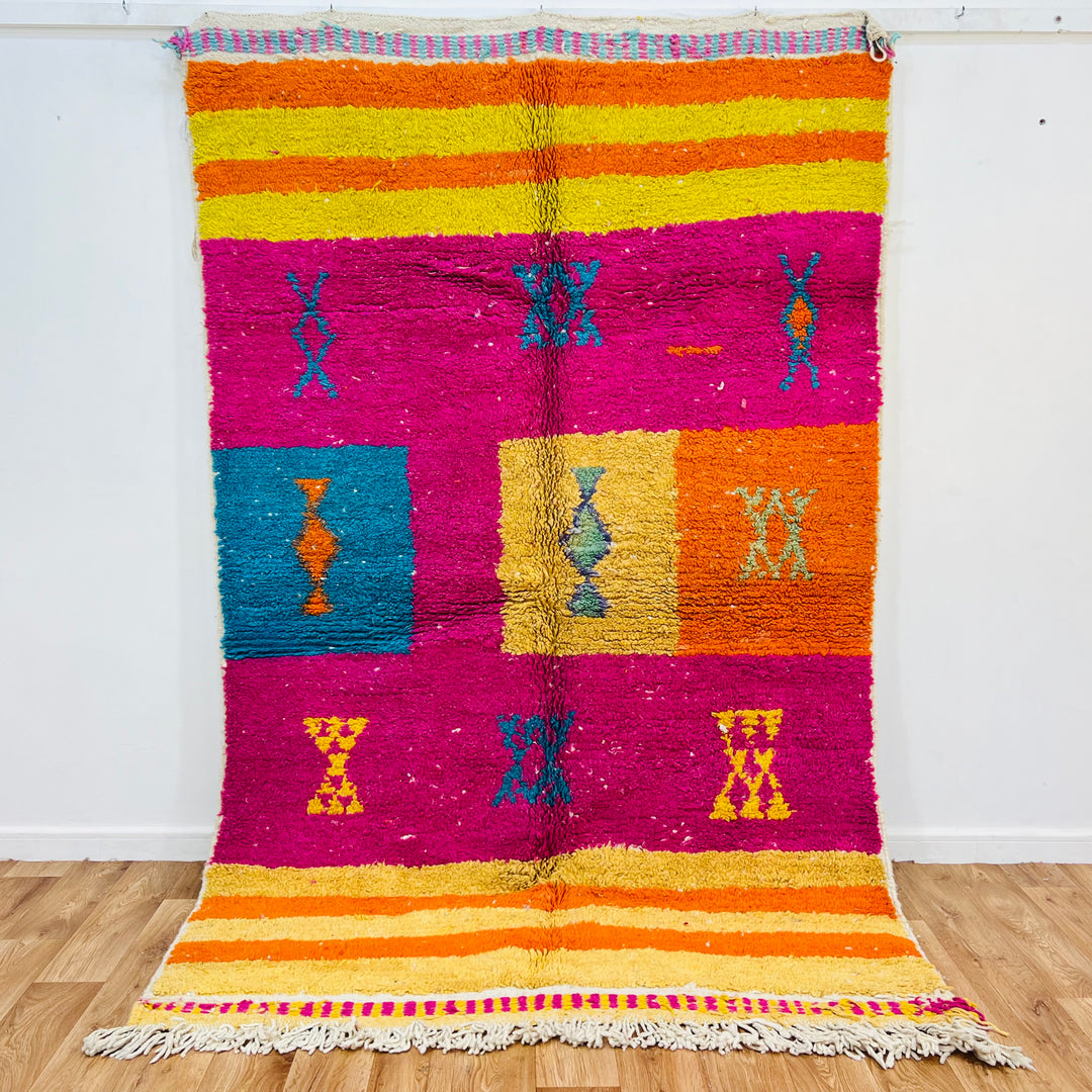 Vintage Moroccan wool rug with colorful Berber motifs in pink, orange, yellow, and teal – Rug 607, size 250x157 cm.

