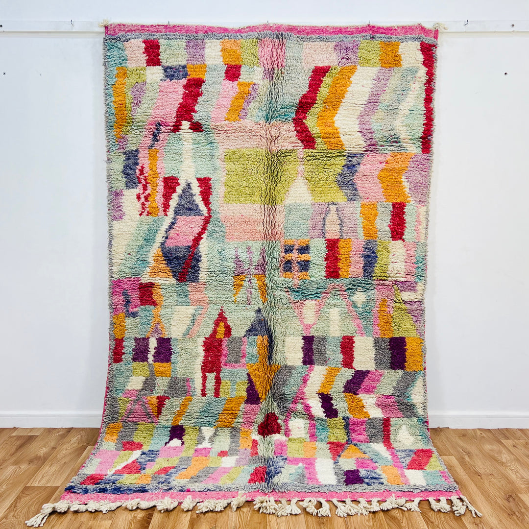 Colorful vintage Moroccan rug with geometric patterns, 250 x 156 cm, handwoven by Berber artisans, featuring vibrant wool colors.