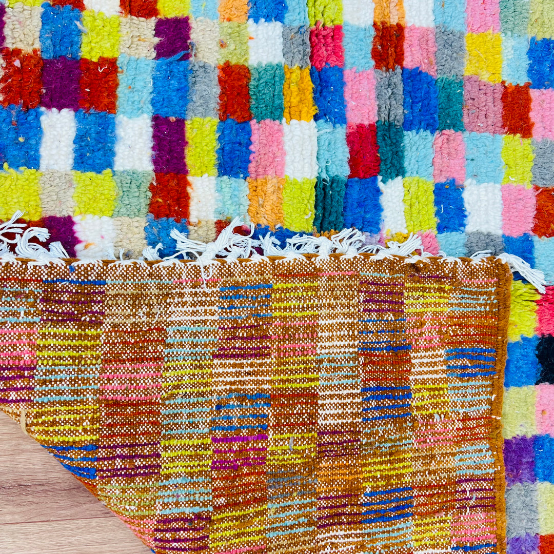 Colorful geometric vintage Moroccan rug with multicolored squares and diamond motifs, handwoven by Berber artisans, 237 x 158 cm.