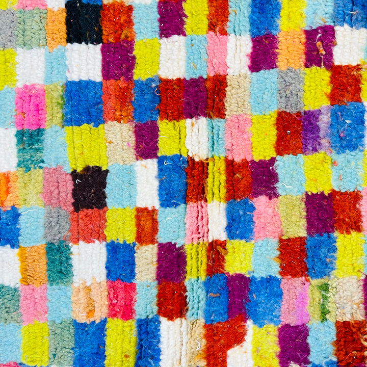 Colorful geometric vintage Moroccan rug with multicolored squares and diamond patterns, handwoven by Berber artisans, 100% wool.