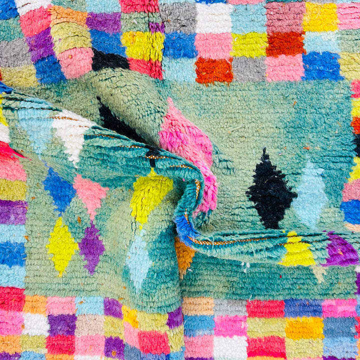 Colorful vintage Moroccan rug with multicolored geometric patterns, handwoven by Berber artisans, 100% wool.