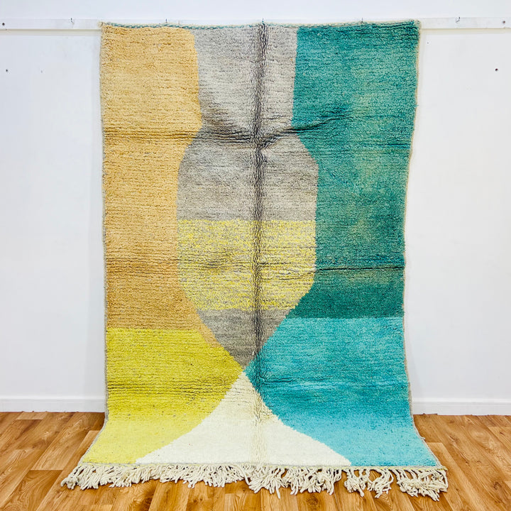 Geometric Earth Tone Moroccan Rug in beige, teal, mustard, and turquoise with abstract patterns, size 240x157 cm.
