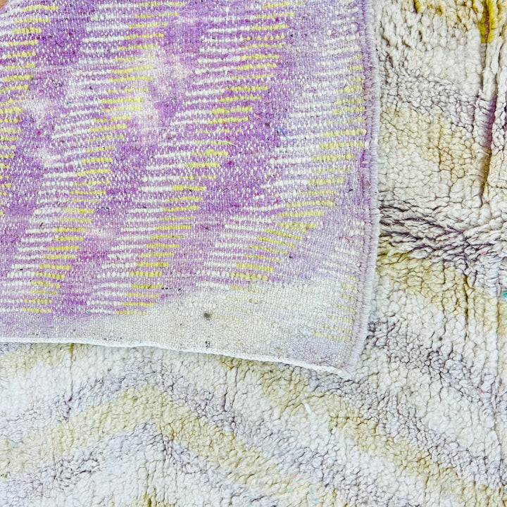 Chevron beige vintage Moroccan rug with lilac and yellow accents, handmade wool carpet, 246x162 cm, showcasing cultural design.