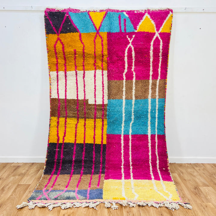 Colorful Moroccan vintage rug with fuchsia, orange, turquoise, geometric patterns, handmade Berber craftsmanship. Size 265x154 cm.