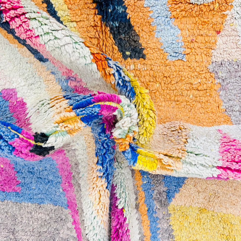 Vintage Moroccan wool rug with vibrant geometric patterns in orange, pink, blue, by Berber artisans. Size: 243 x 167 cm.