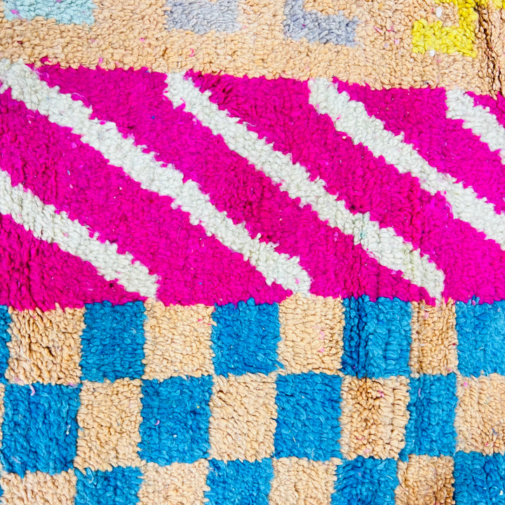 Vintage Moroccan Rug No. 636 – Colorful wool rug with tribal patterns and vertical stripes in pink, blue, yellow

