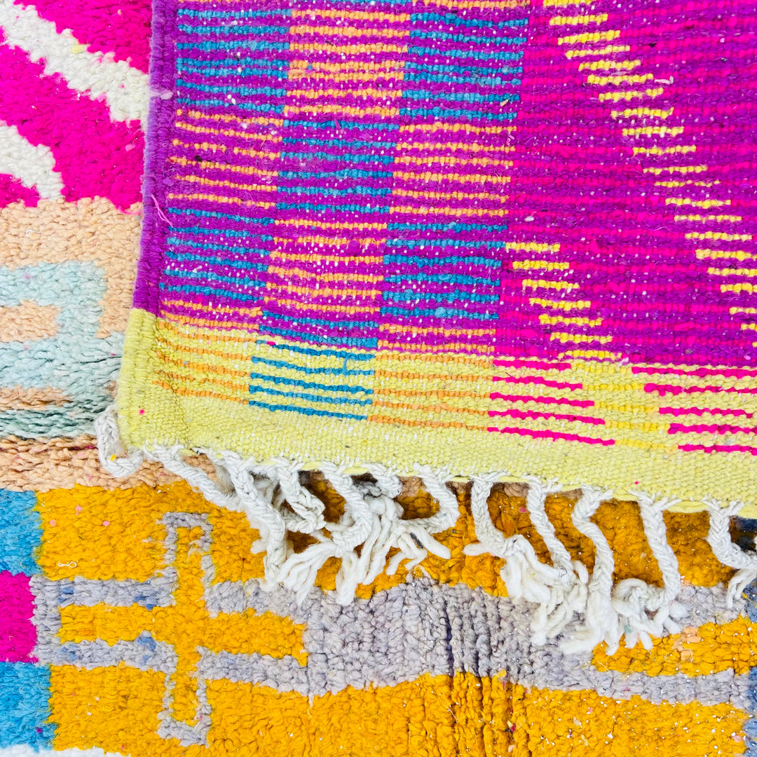 Vintage Moroccan Rug No. 636 – Colorful wool rug with tribal patterns and vertical stripes in pink, blue, yellow


