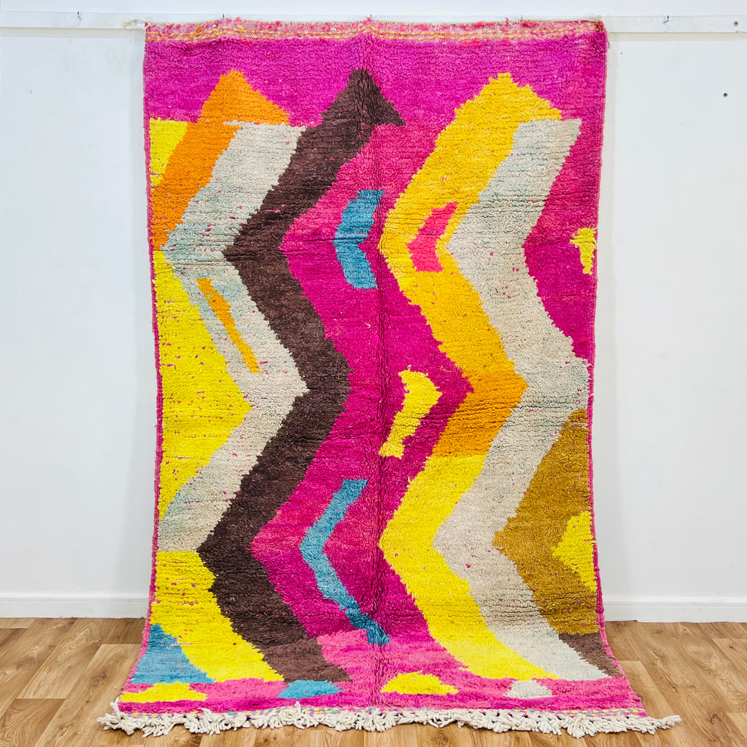 Vintage Moroccan wool rug in bold pink, yellow, and blue zig-zag pattern – handmade 244x150 cm

