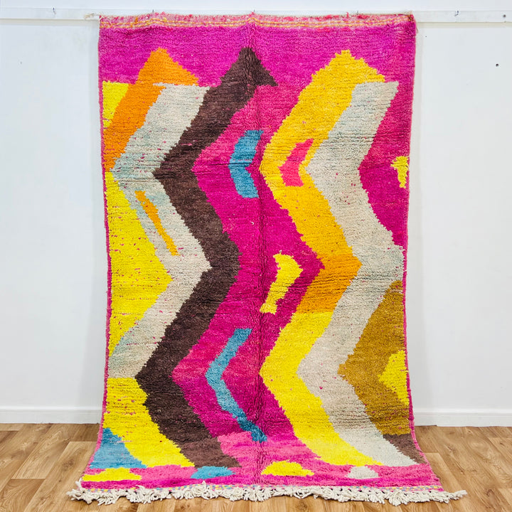 Vintage Moroccan wool rug in bold pink, yellow, and blue zig-zag pattern – handmade 244x150 cm

