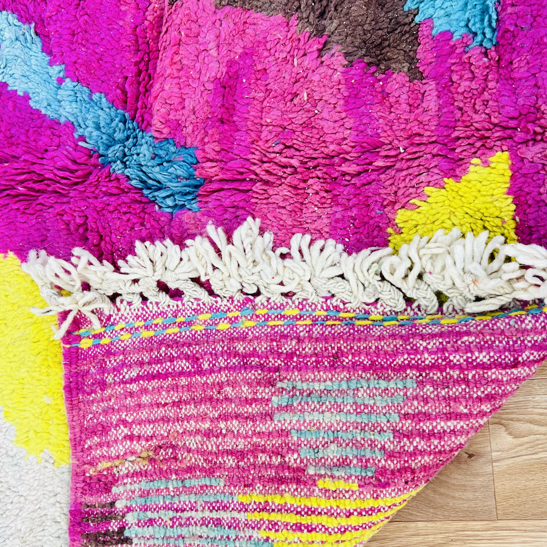 Vintage Moroccan wool rug in bold pink, yellow, and blue zig-zag pattern – handmade 244x150 cm

