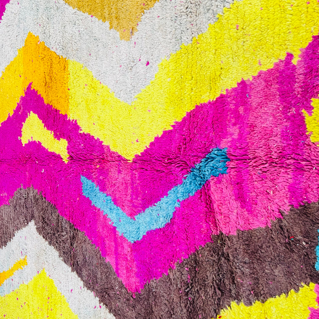 Vintage Moroccan wool rug in bold pink, yellow, and blue zig-zag pattern – handmade 244x150 cm

