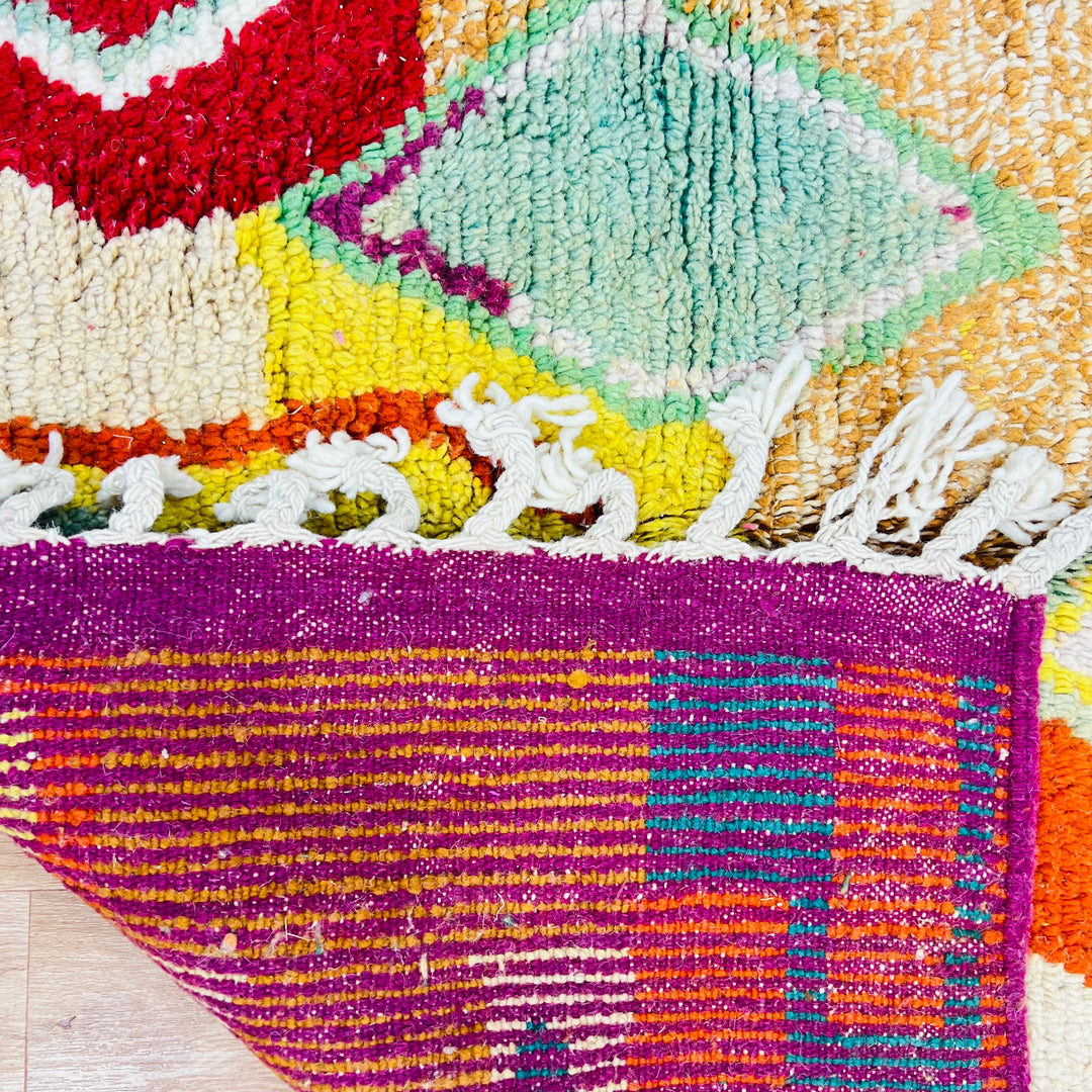 Vintage Moroccan rug No. 653 with colorful geometric Berber motifs in yellow, green, and red wool


