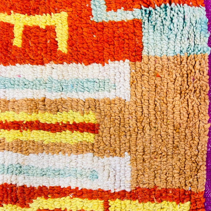 Vintage Moroccan rug No. 653 with colorful geometric Berber motifs in yellow, green, and red wool

