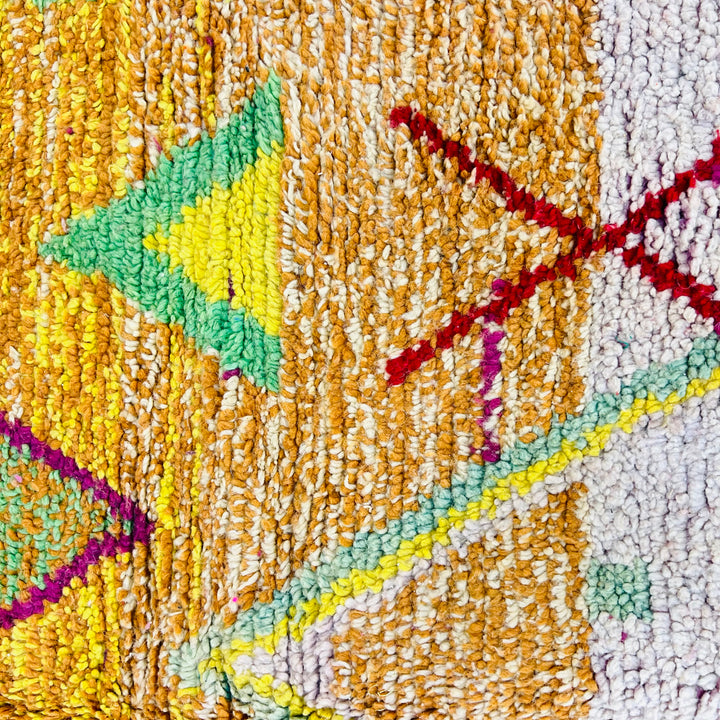 Vintage Moroccan rug No. 653 with colorful geometric Berber motifs in yellow, green, and red wool

