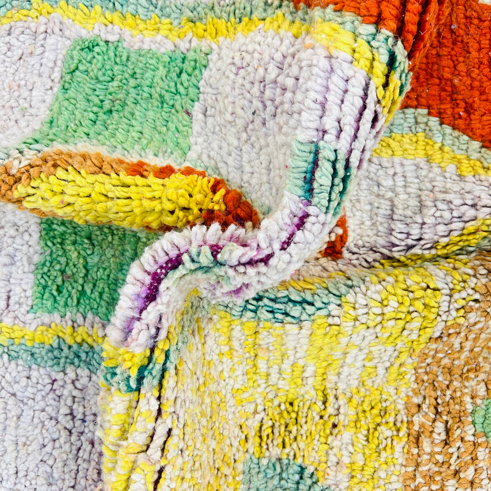 Vintage Moroccan rug No. 653 with colorful geometric Berber motifs in yellow, green, and red wool

