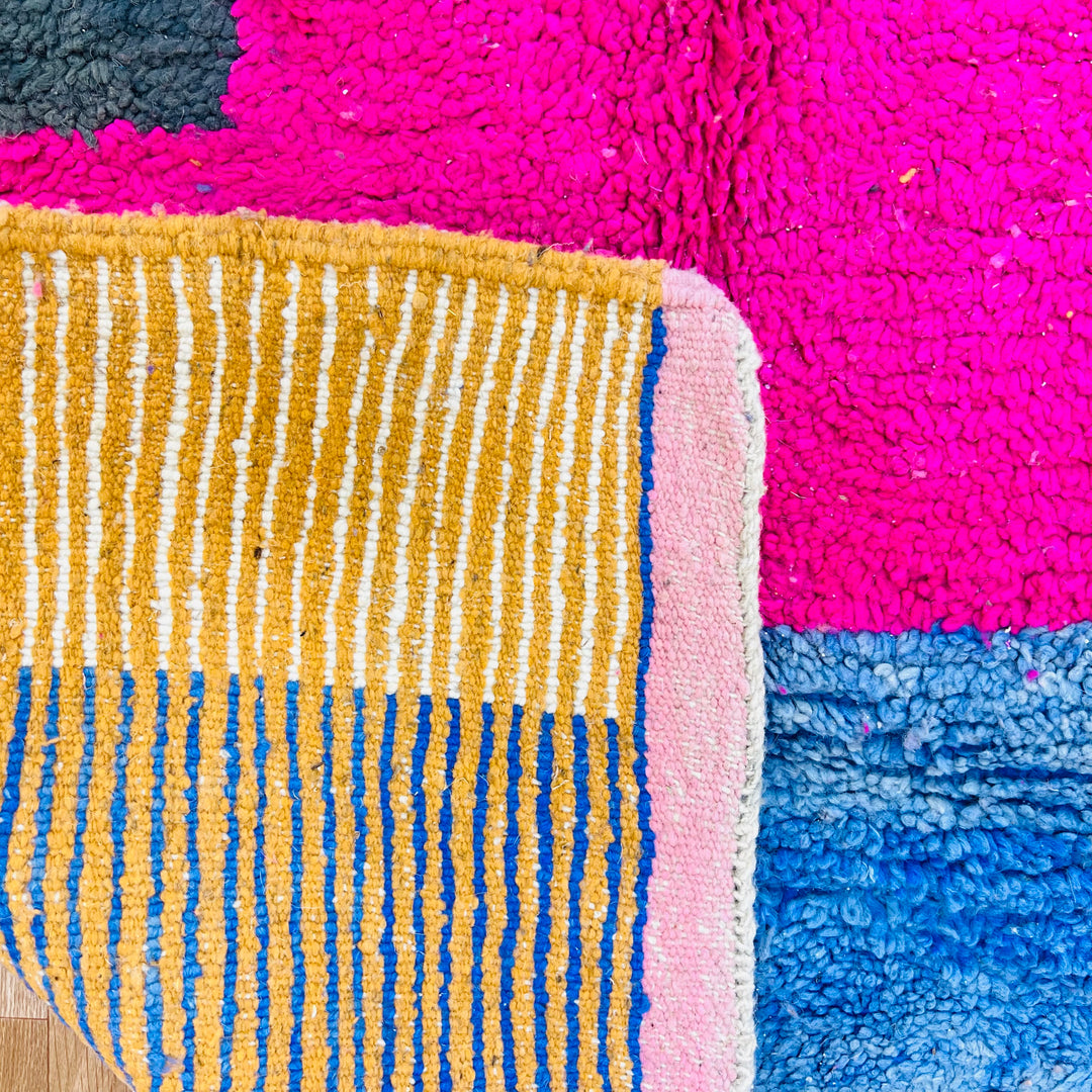 Vintage Moroccan wool rug 610 with colorful modern abstract design in pink, blue, green, and cream

