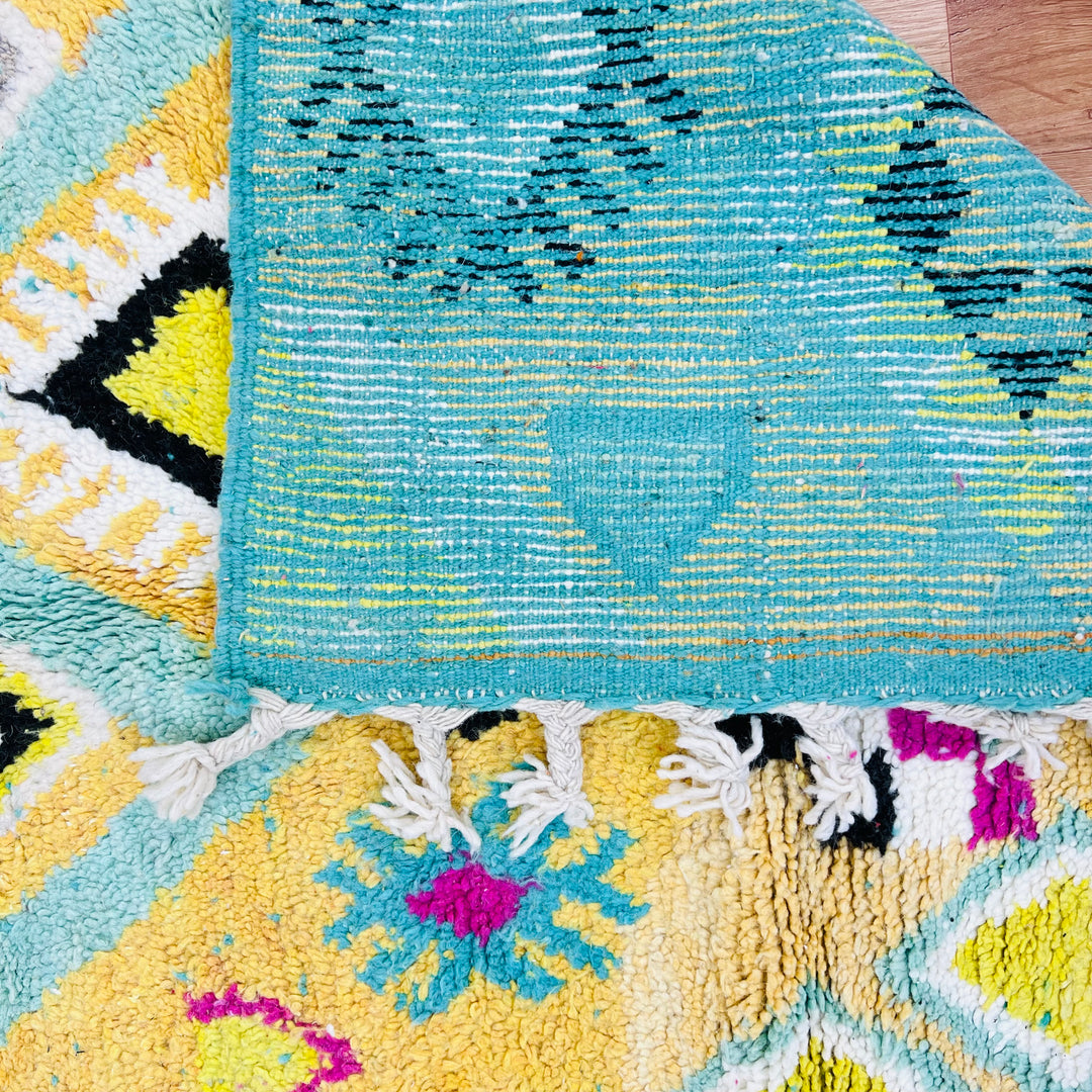 Colorful vintage Moroccan wool rug with yellow, pink, and black Amazigh symbols – Rug 698


