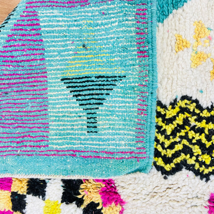 Colorful vintage Moroccan wool rug with yellow, pink, and black Amazigh symbols – Rug 698

