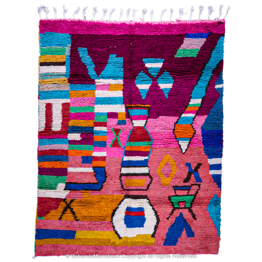 Handmade Moroccan rug with colorful striped and tribal motifs in vibrant wool