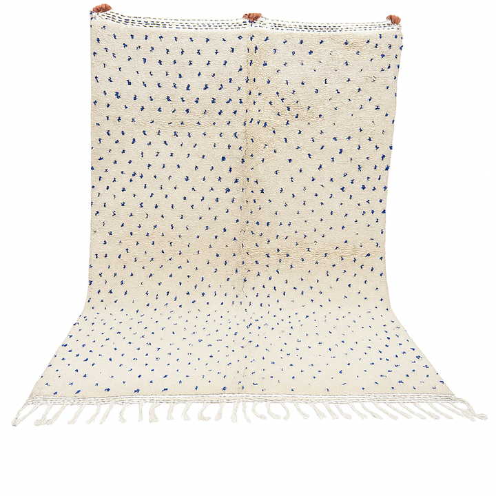 Handmade ivory Moroccan wool rug with blue dotted design – minimalist Berber rug