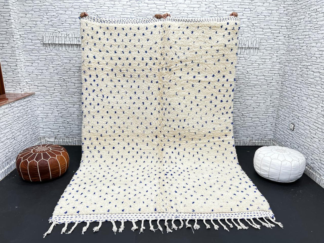 Handmade ivory Moroccan wool rug with blue dotted design – minimalist Berber rug
