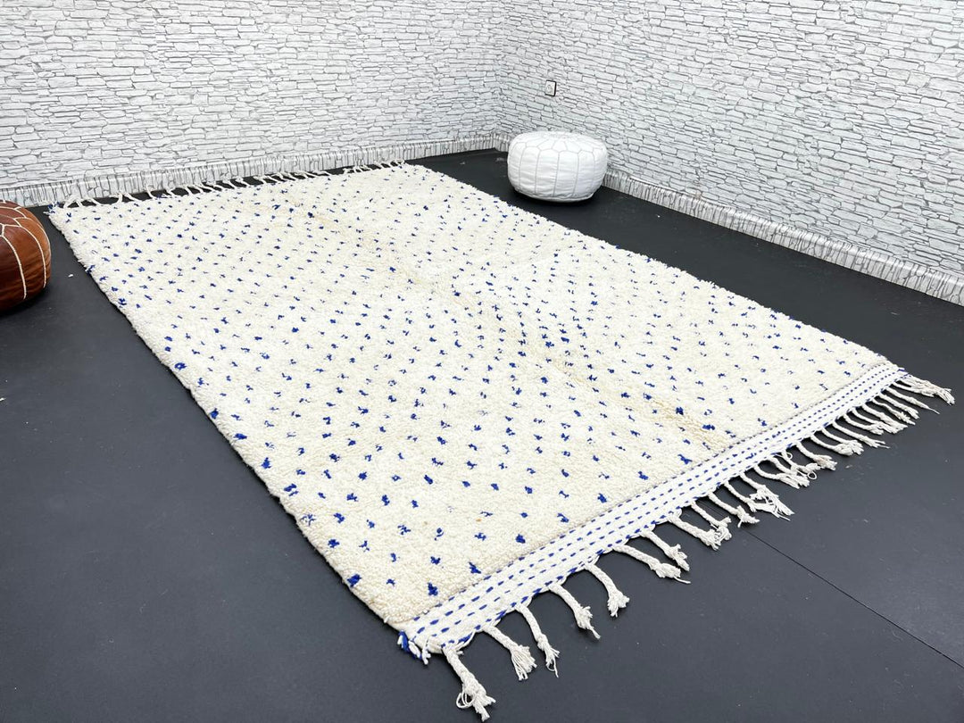Handmade ivory Moroccan wool rug with blue dotted design – minimalist Berber rug