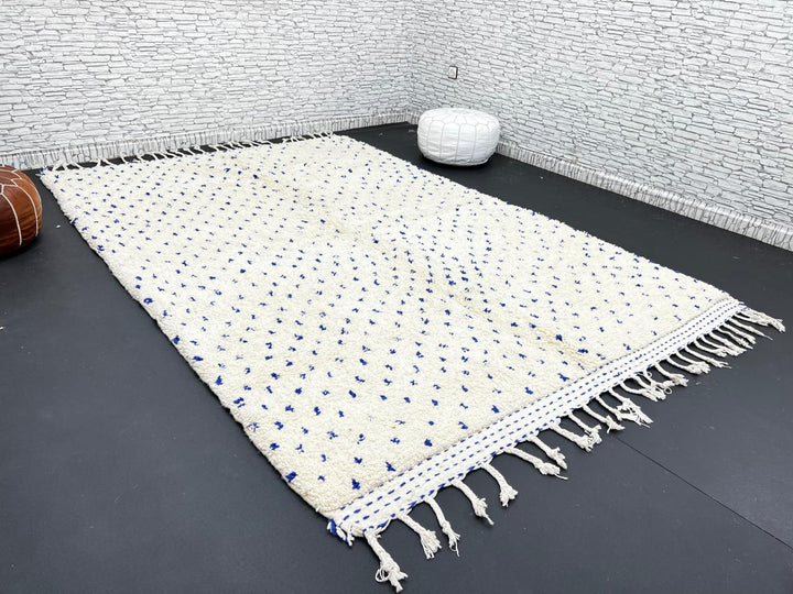 Handmade ivory Moroccan wool rug with blue dotted design – minimalist Berber rug