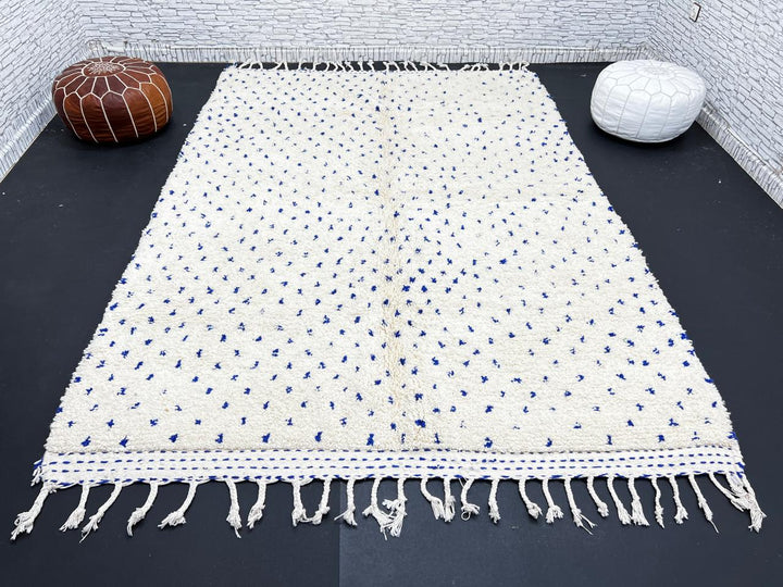 Handmade ivory Moroccan wool rug with blue dotted design – minimalist Berber rug