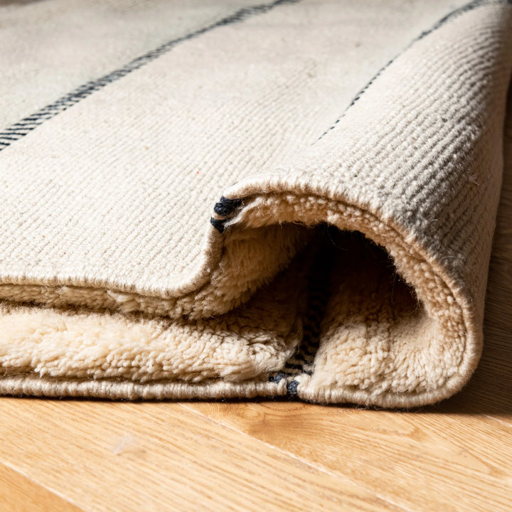 Ivory Moroccan Wool Rug with Subtle Horizontal Black Lines