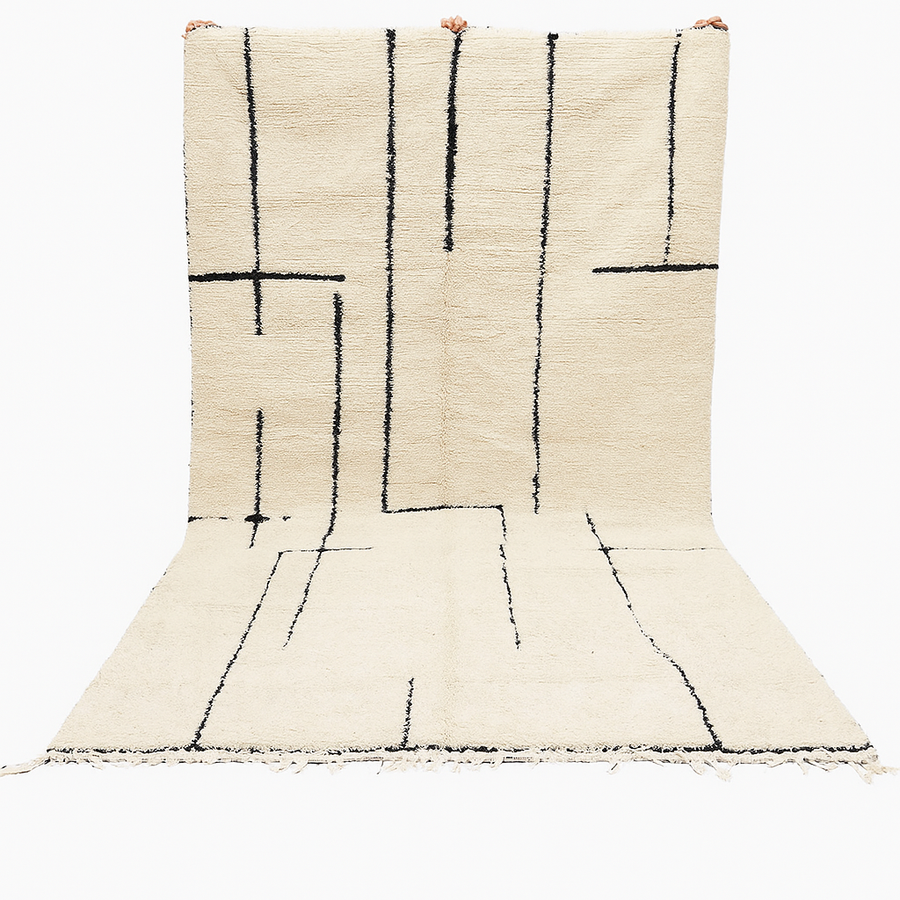 Handmade ivory Moroccan wool rug with abstract black line design – modern Beni Ourain style
