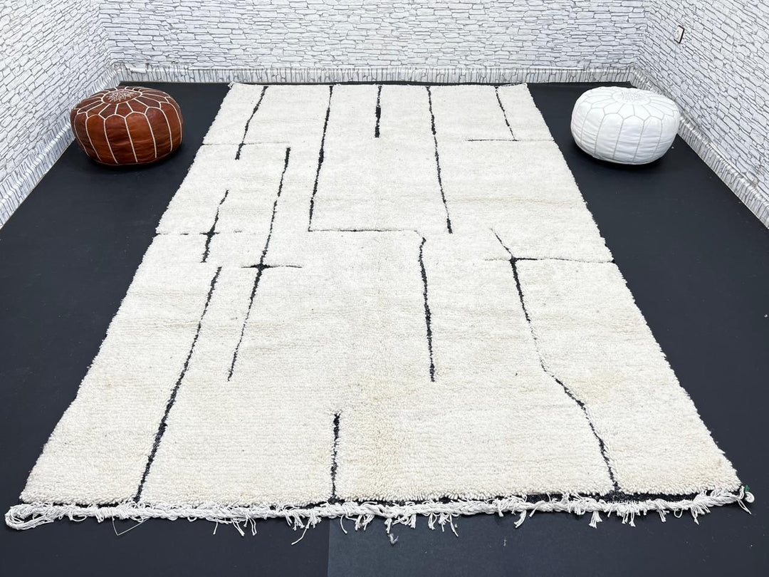 Handmade ivory Moroccan wool rug with abstract black line design – modern Beni Ourain style