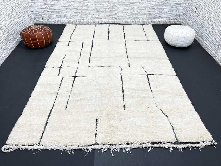 Handmade ivory Moroccan wool rug with abstract black line design – modern Beni Ourain style