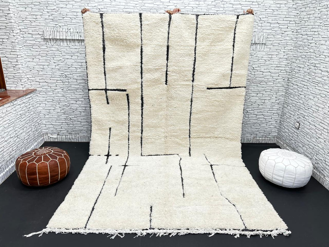 Handmade ivory Moroccan wool rug with abstract black line design – modern Beni Ourain style