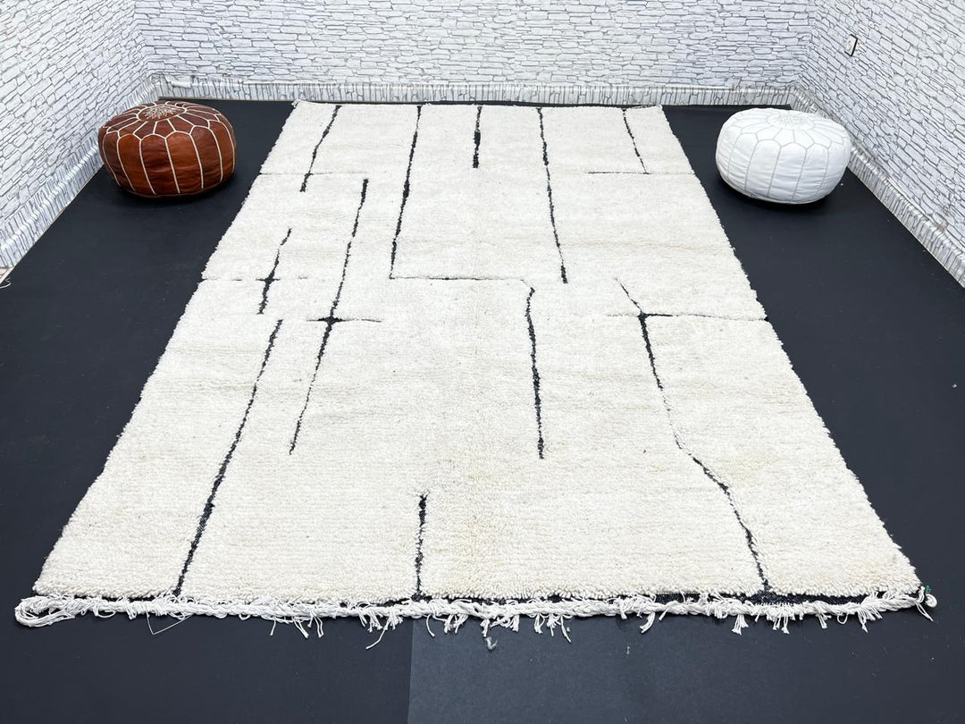 Handmade ivory Moroccan wool rug with abstract black line design – modern Beni Ourain style
