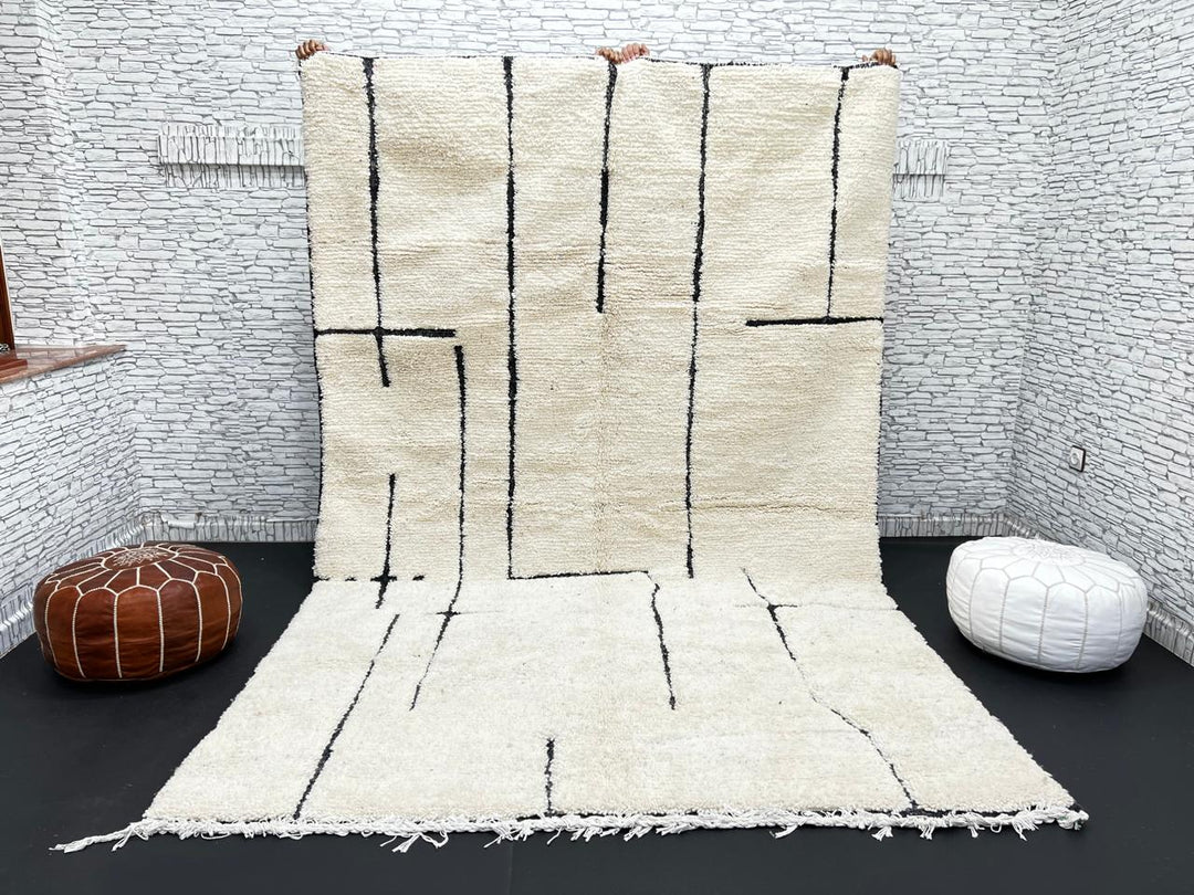 Handmade ivory Moroccan wool rug with abstract black line design – modern Beni Ourain style